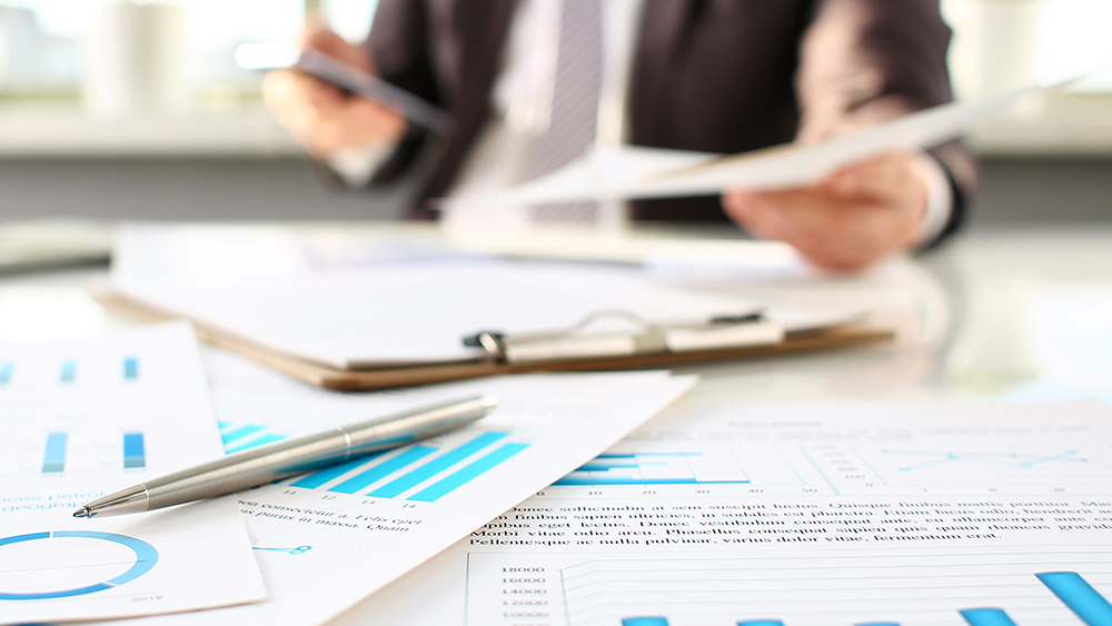 Desk with pen and paper